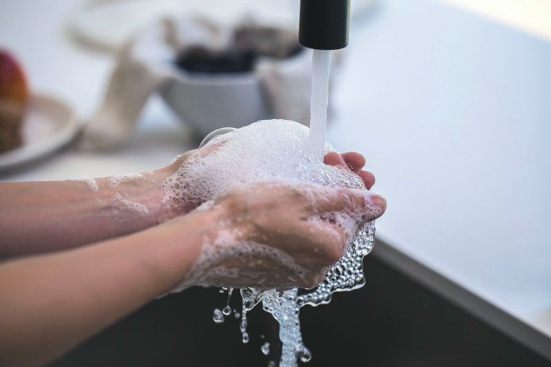 person washing hands