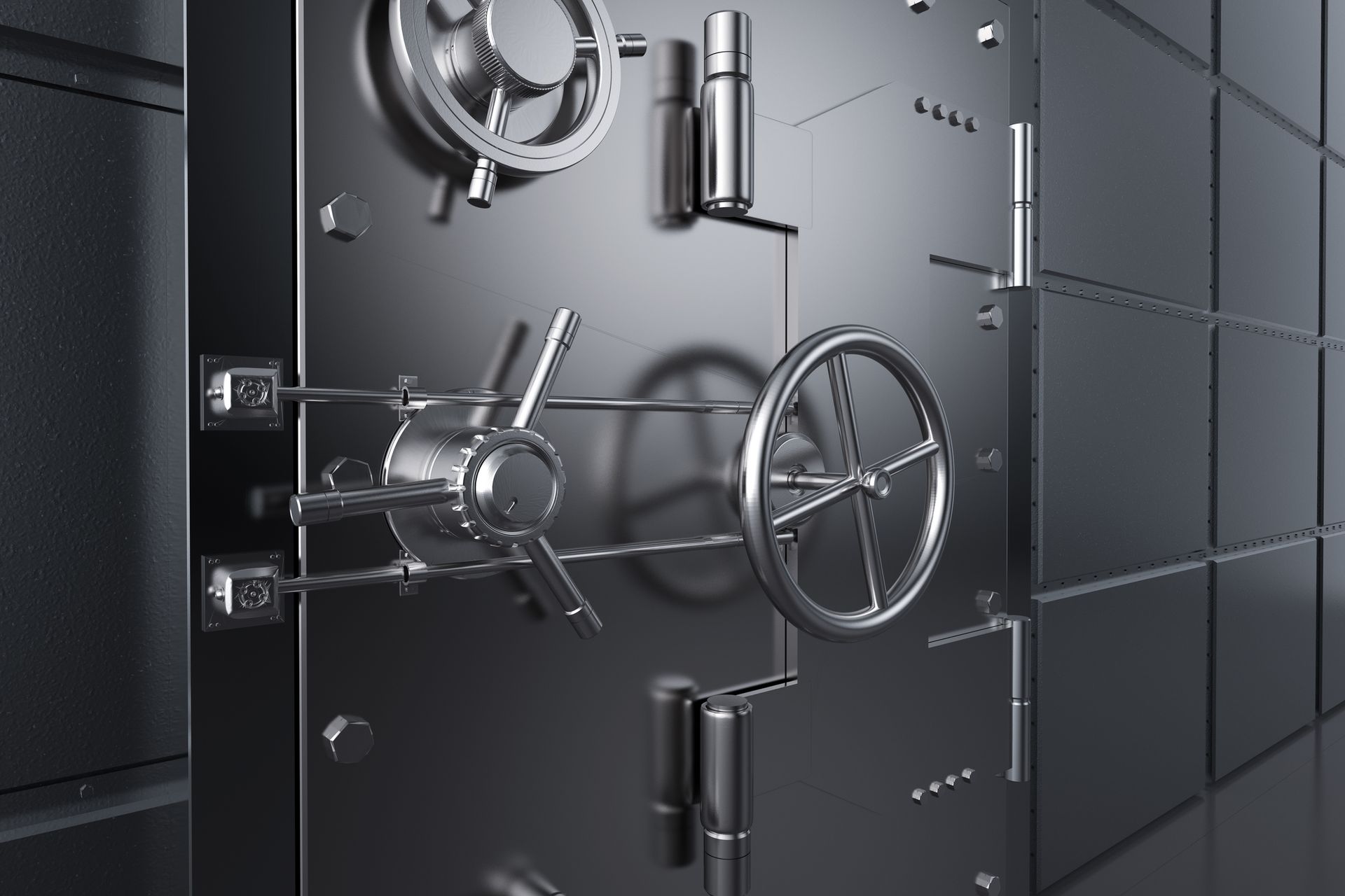 Silver bank vault door, with a large handle and combination lock.