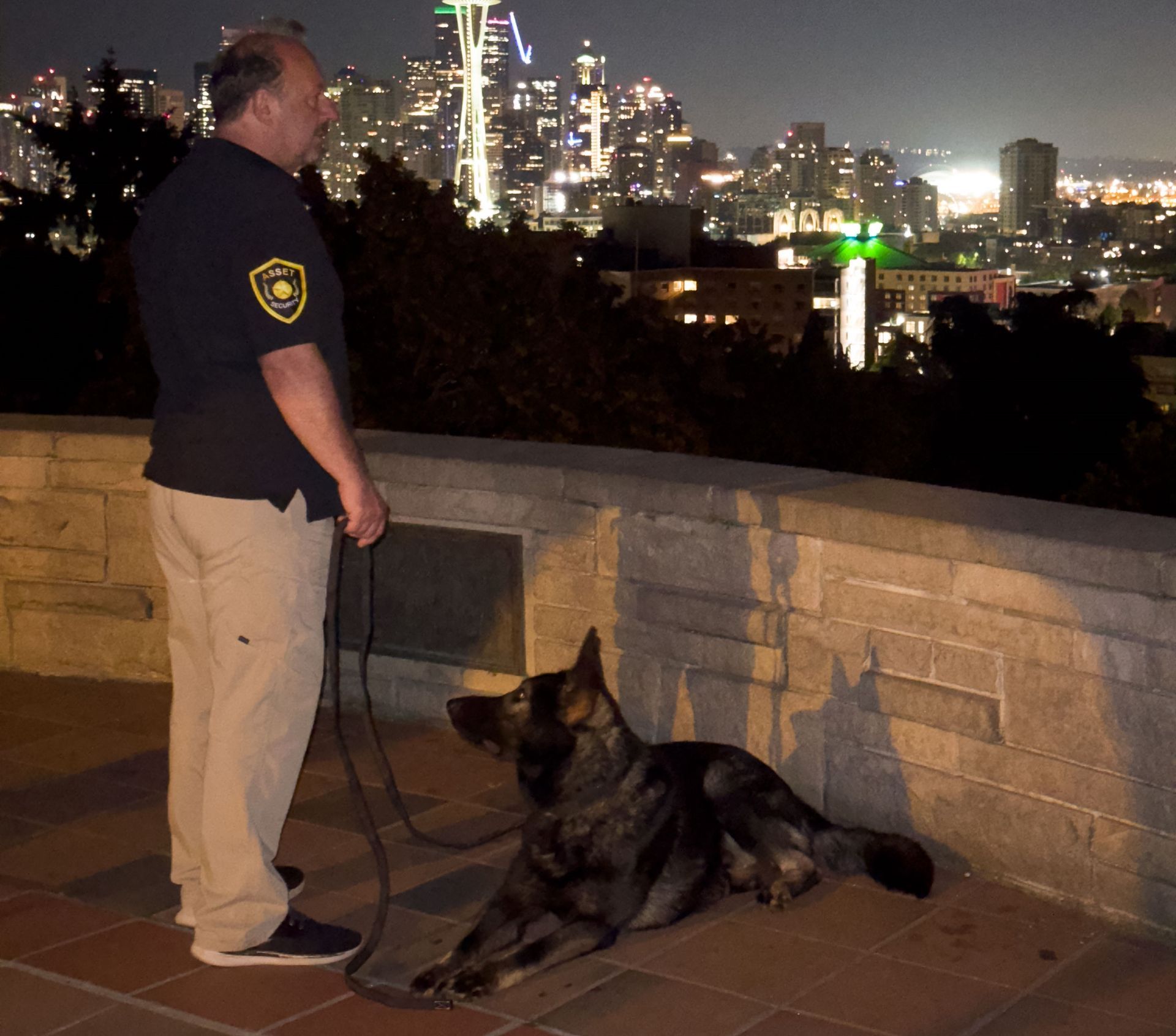 2 Man Holding 2 Dogs On A Dock – Redmond, WA – Asset Security Northwest