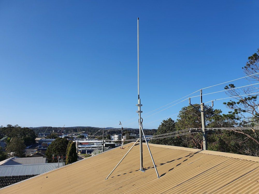 A White Antenna on Top of a Building With a Blue Sky in the Background — AitkenTech in Moruya, NSW