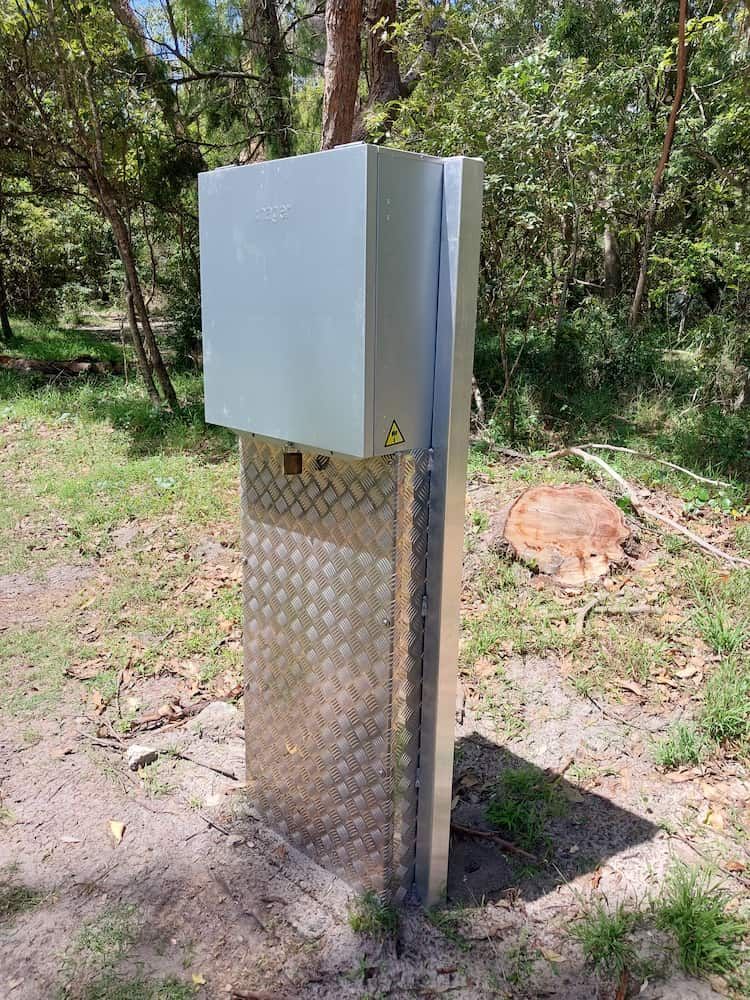 A Metal Box is Sitting on Top of a Metal Pole in the Middle of a Field — AitkenTech in Bermagui, NSW