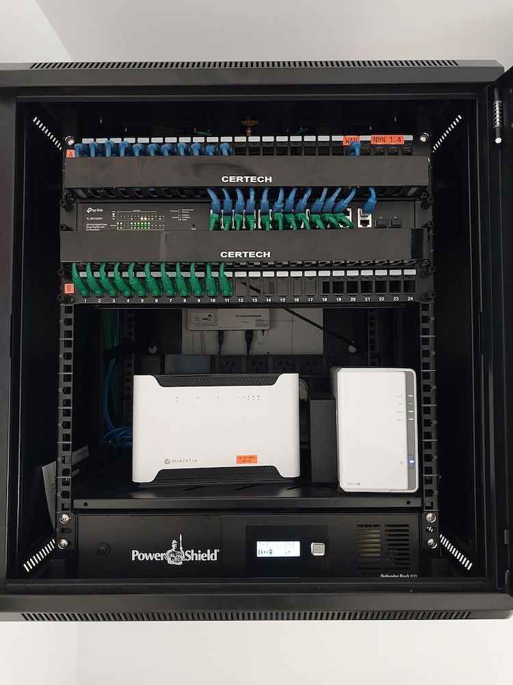 A Server Rack With a Lot of Electronics in It — AitkenTech in Moruya, NSW