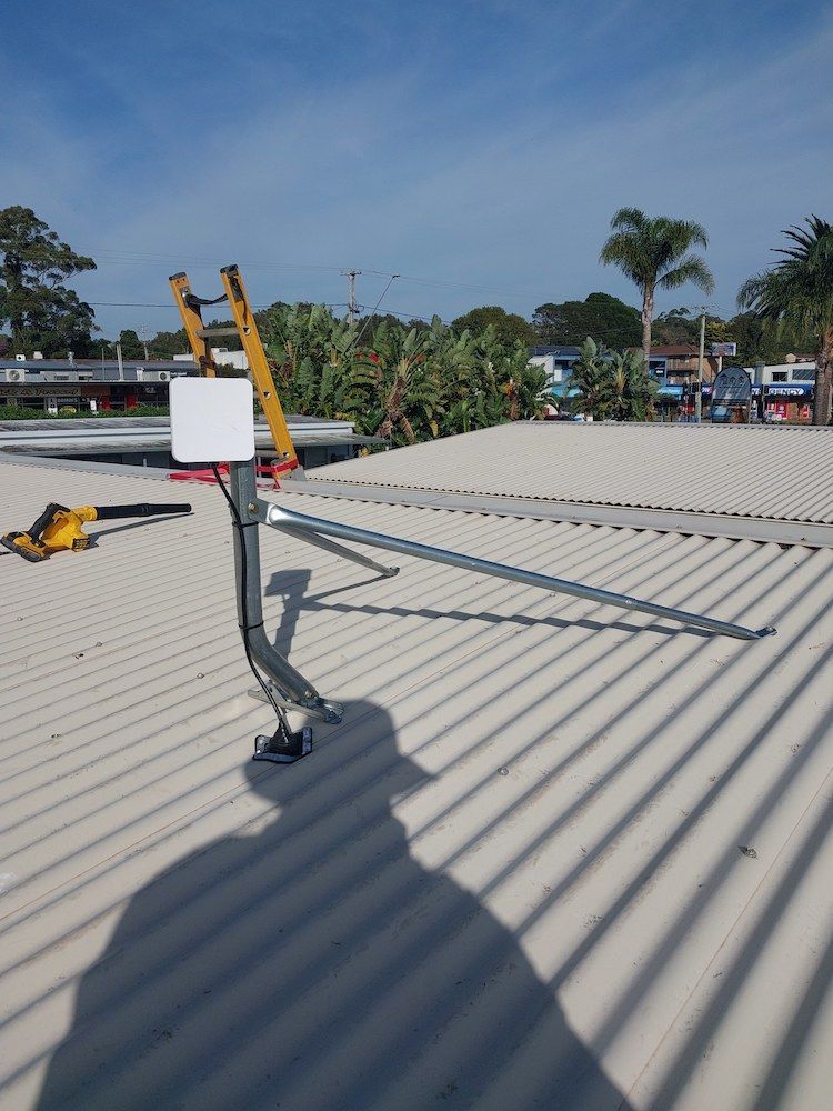 A Shadow of a Person is Cast on the Roof of a Building — AitkenTech in Moruya, NSW