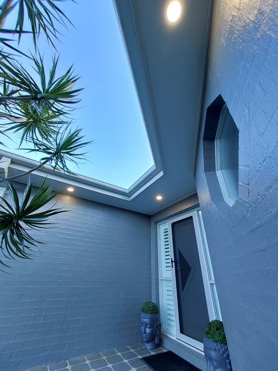 A Gray House With a White Door and a Skylight Above the Door — AitkenTech in Moruya, NSW