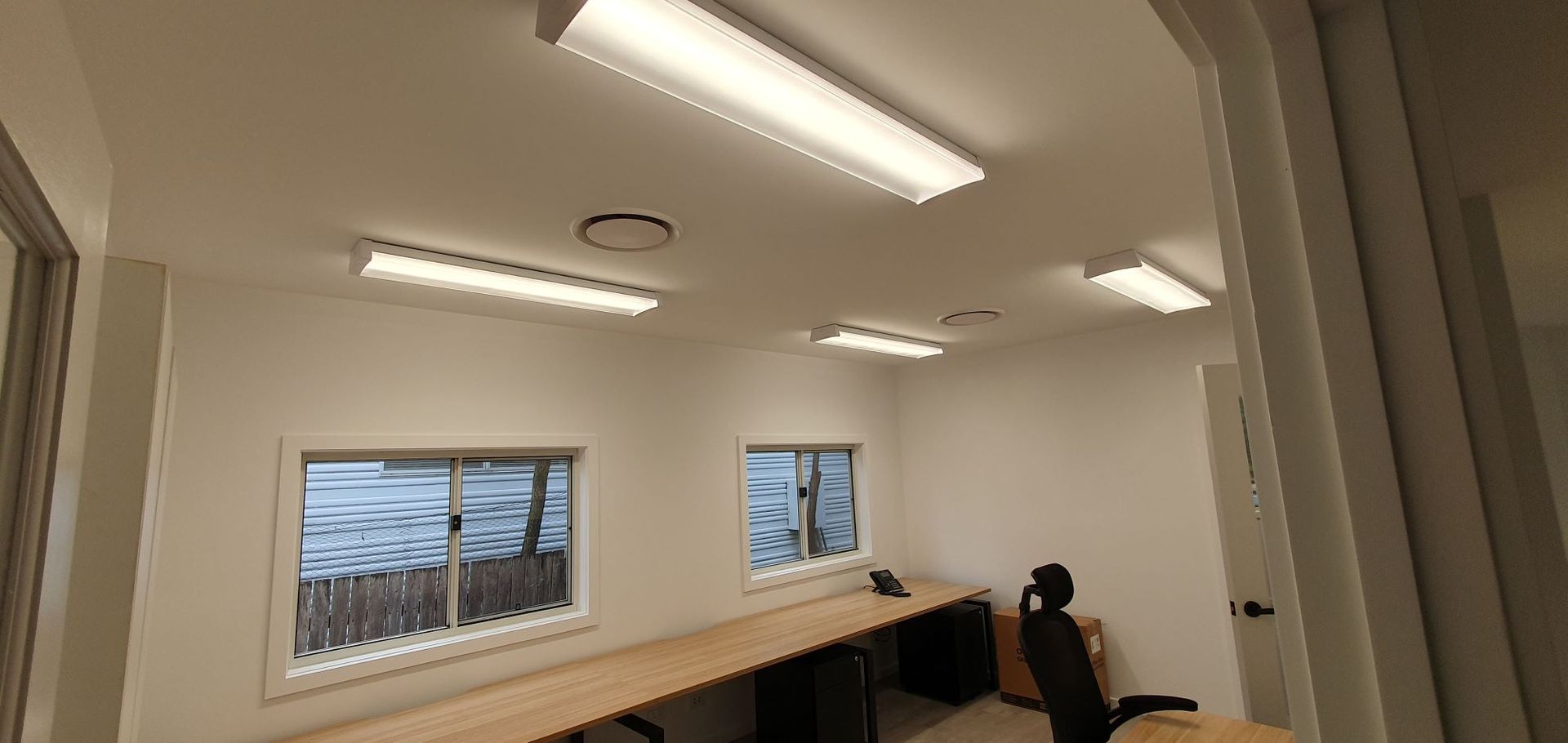 A Room With Two Desks and a Chair in It — AitkenTech in Narooma, NSW