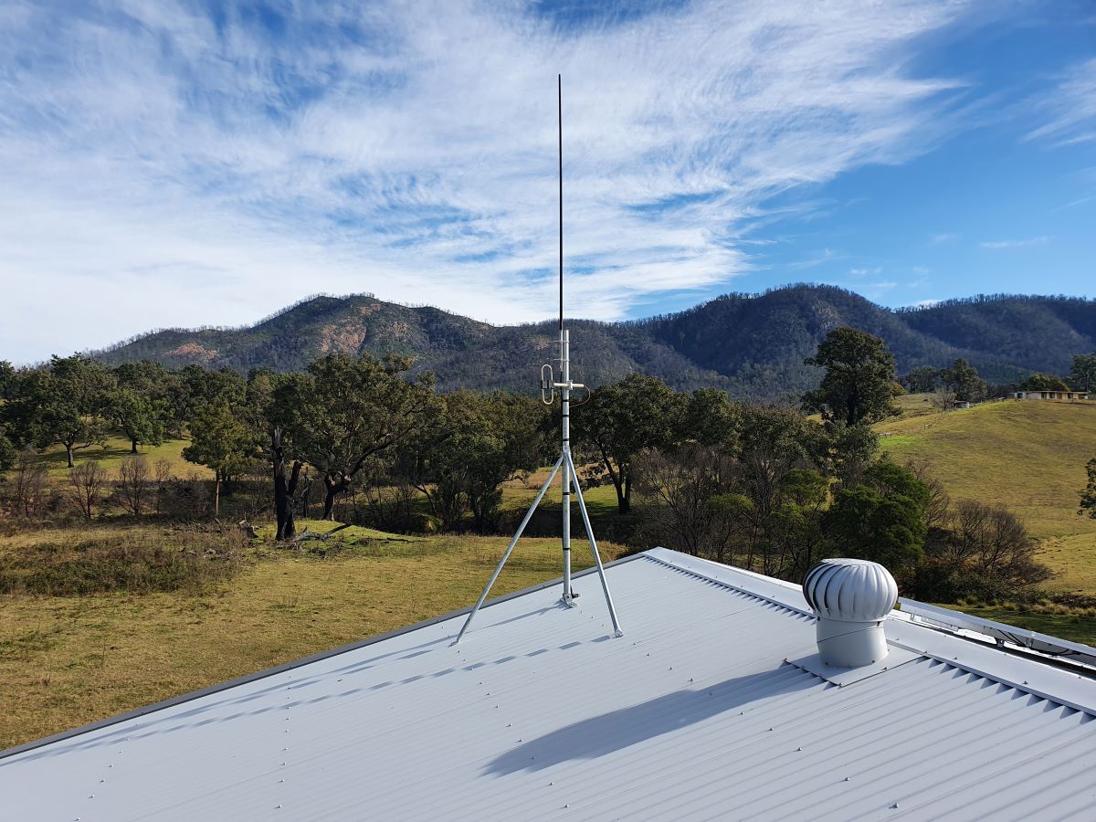 A Roof With a Antenna on Top of It and Mountains in the Background — AitkenTech in Moruya, NSW