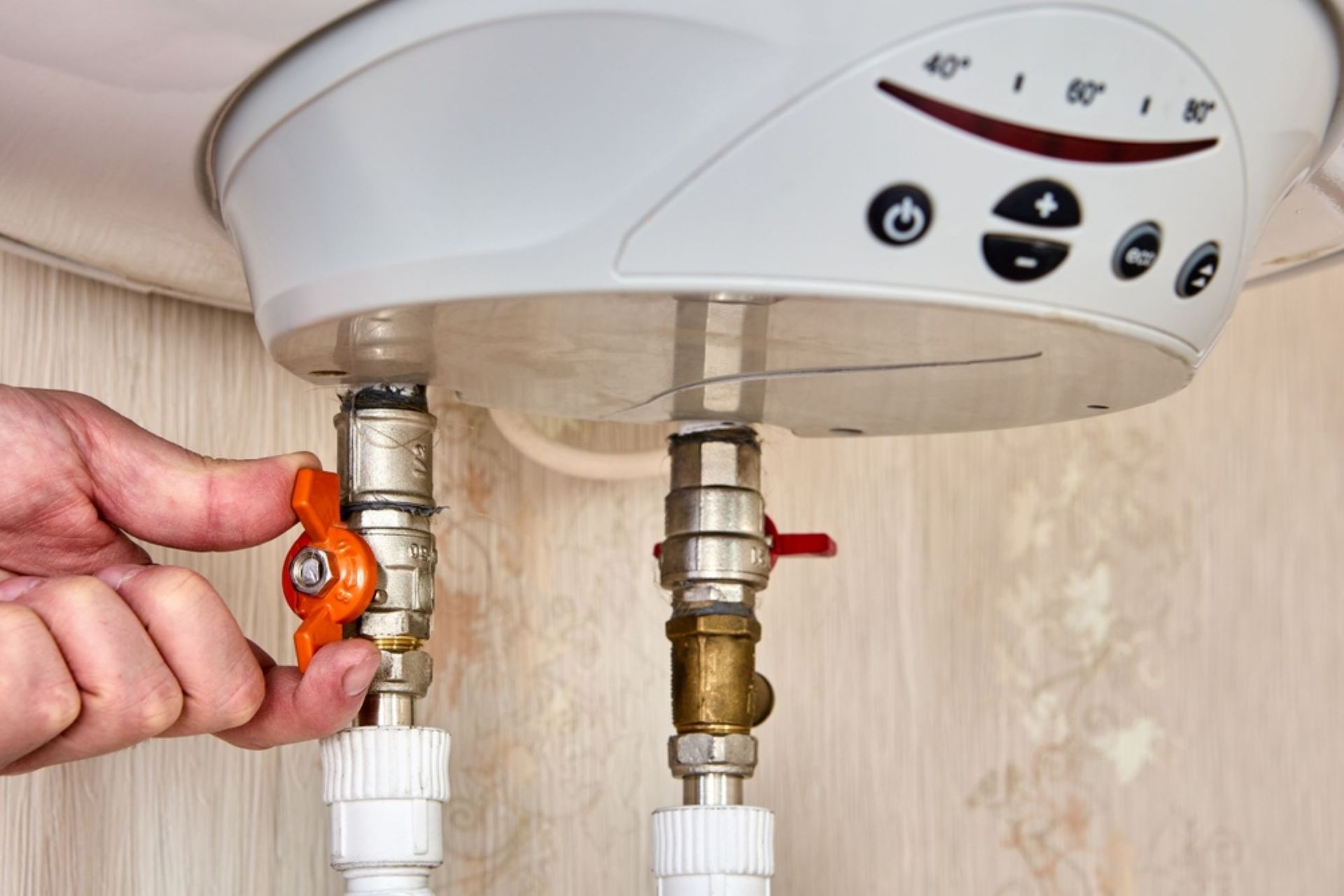 A Person is Fixing a Water Heater With a Valve — AitkenTech in Moruya, NSW