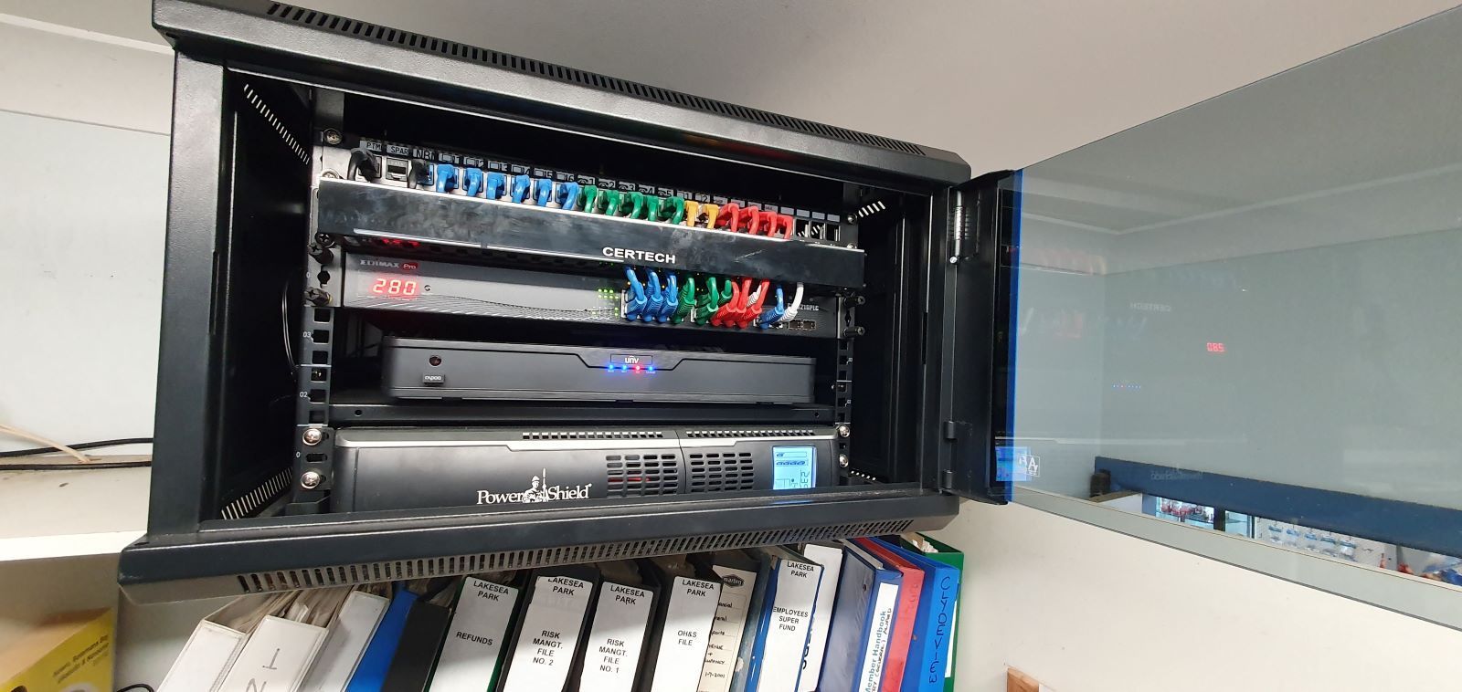 A Server Rack With a Lot of Cables Hanging From It — AitkenTech in Bermagui, NSW