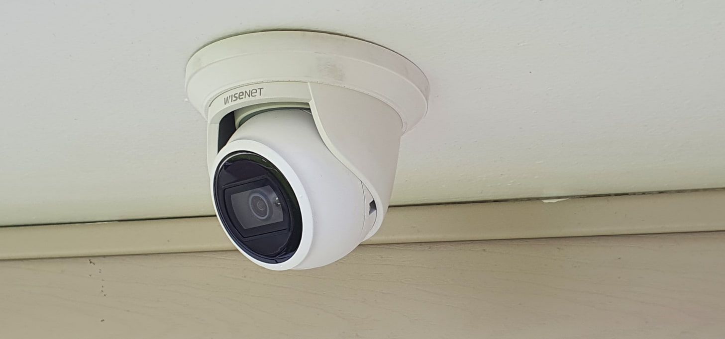 A Security Camera is Mounted to the Ceiling of a Building — AitkenTech in Moruya, NSW