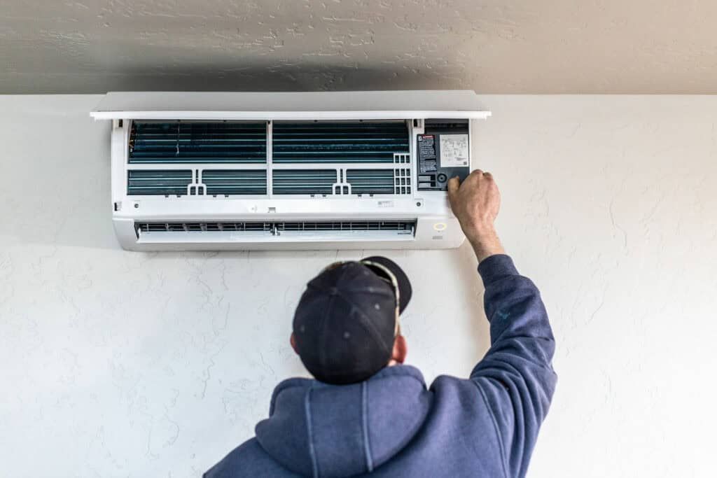 HVAC technician servicing an air conditioner in Star, Idaho