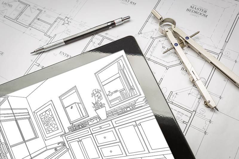 A tablet with a drawing of a kitchen on it.
