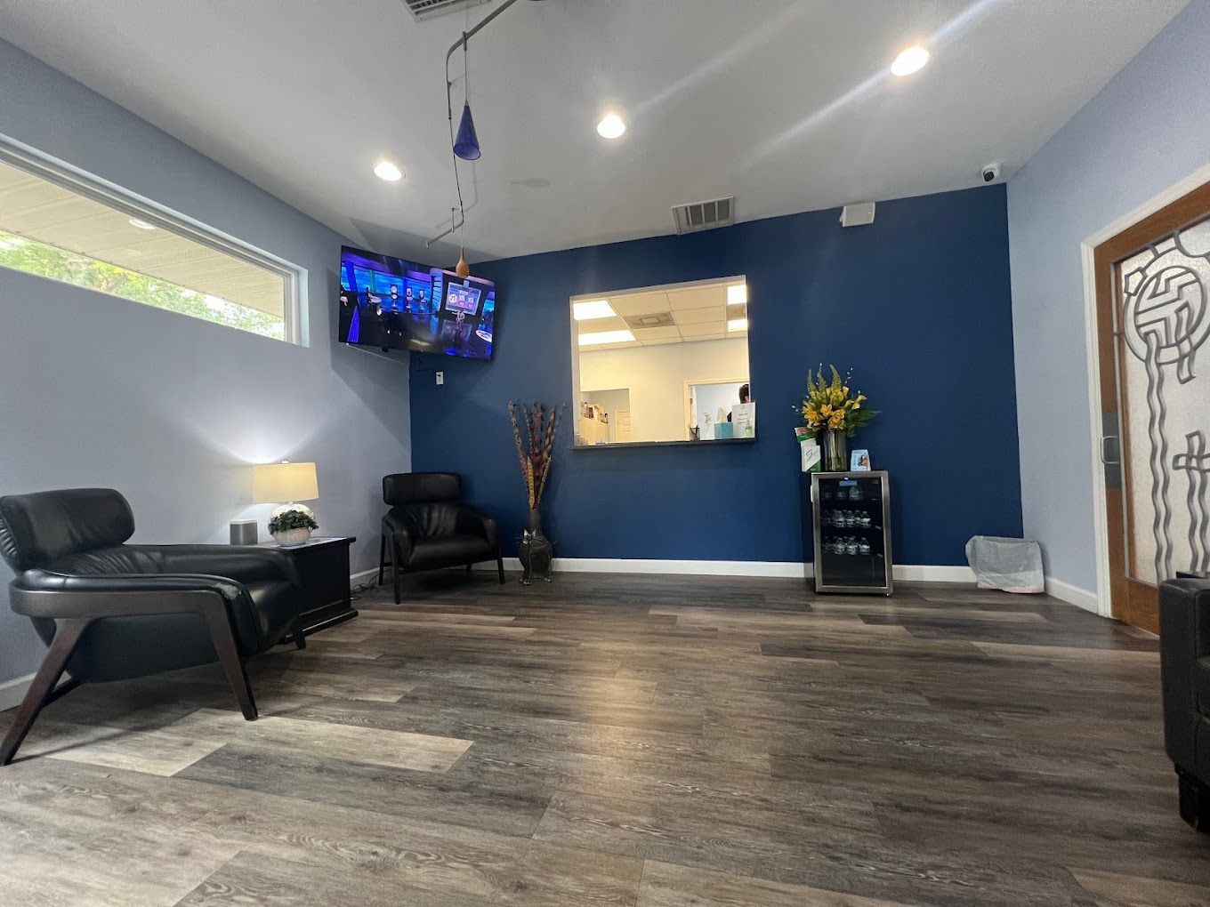 patient on dentist chair with a dog