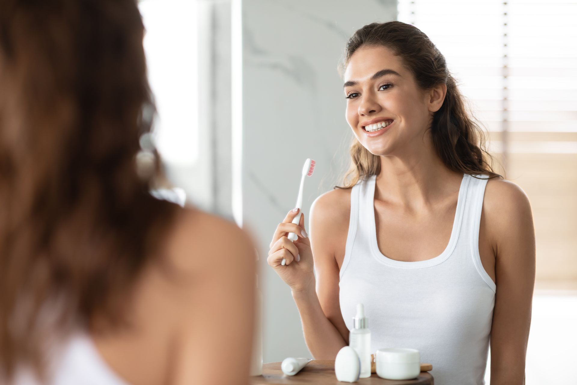 girl brushing her teeth