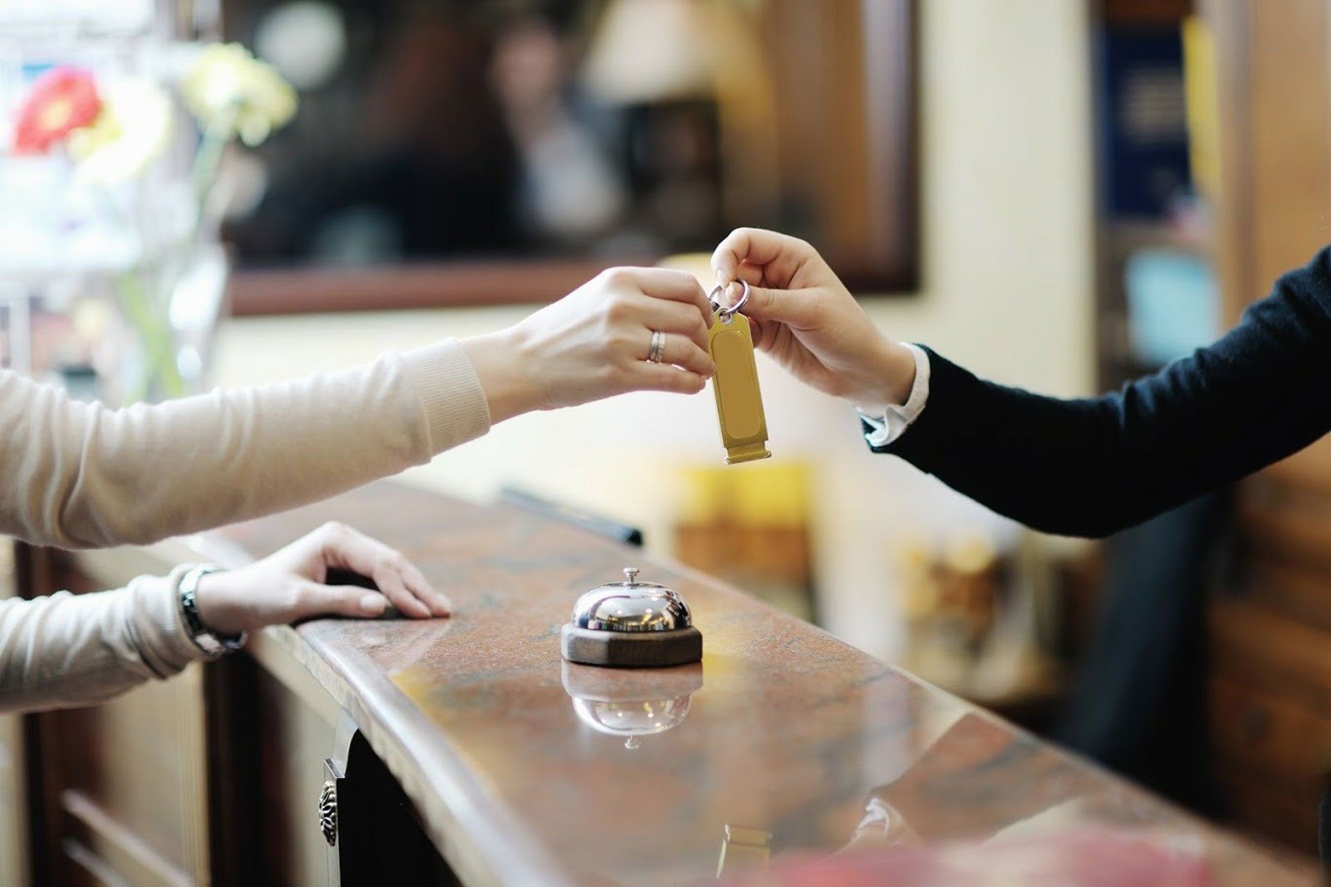 Woman Recieving Hotel Key — Phoenix, AZ — Phoenix Access Control