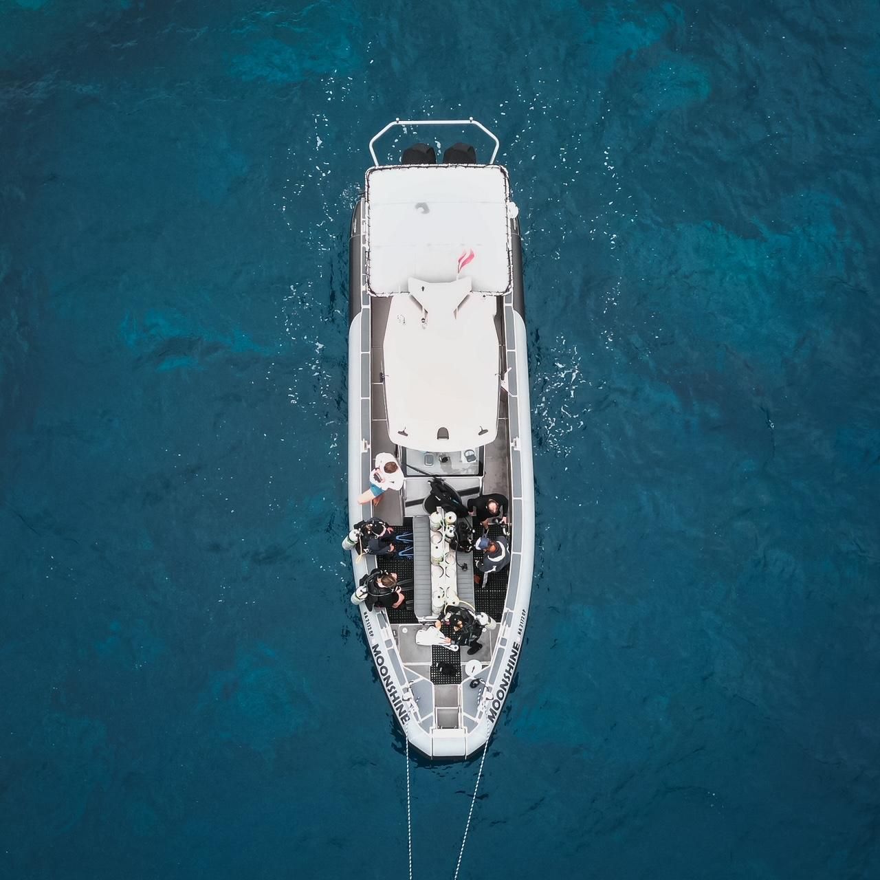 An aerial view of a boat in the ocean