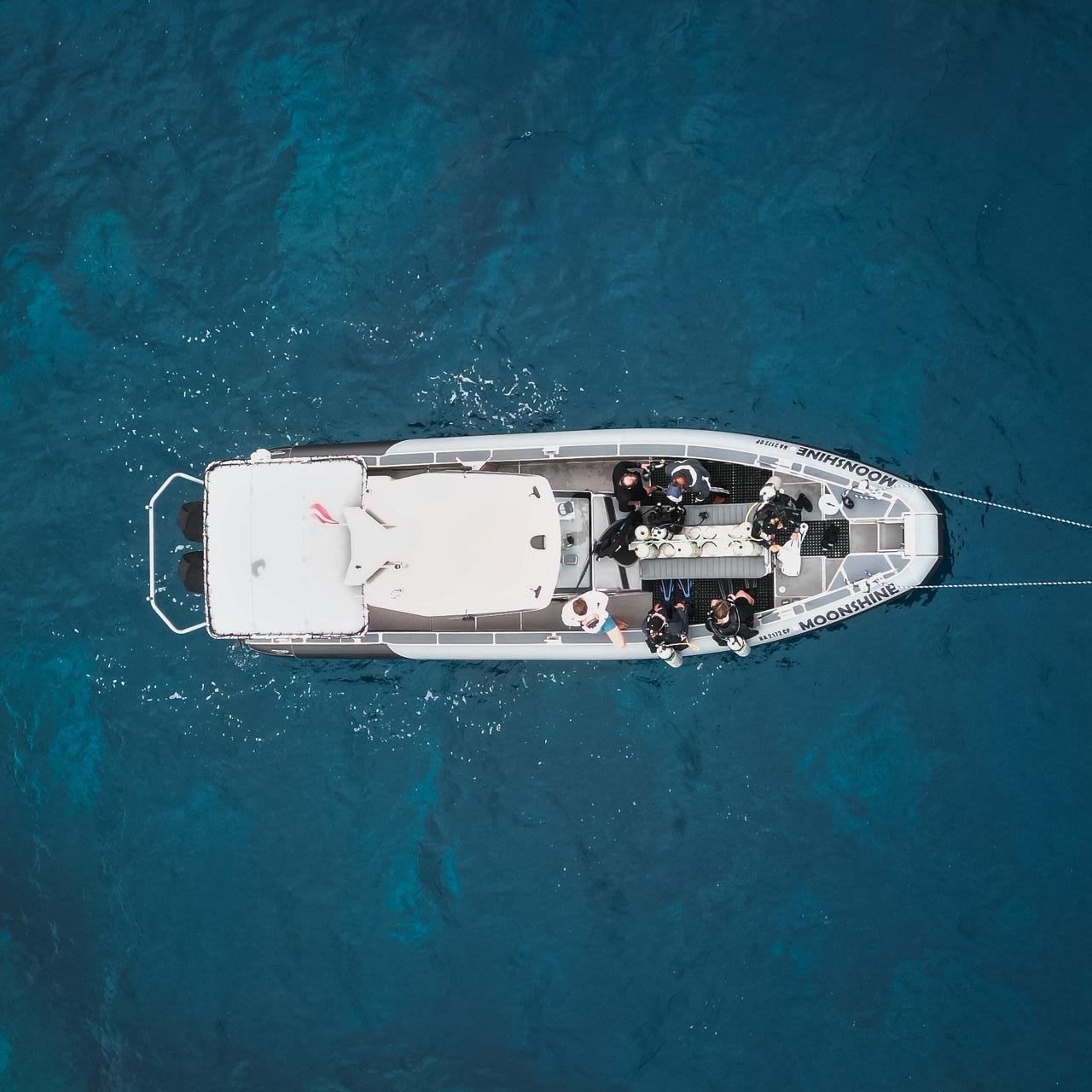 An aerial view of a boat in the ocean