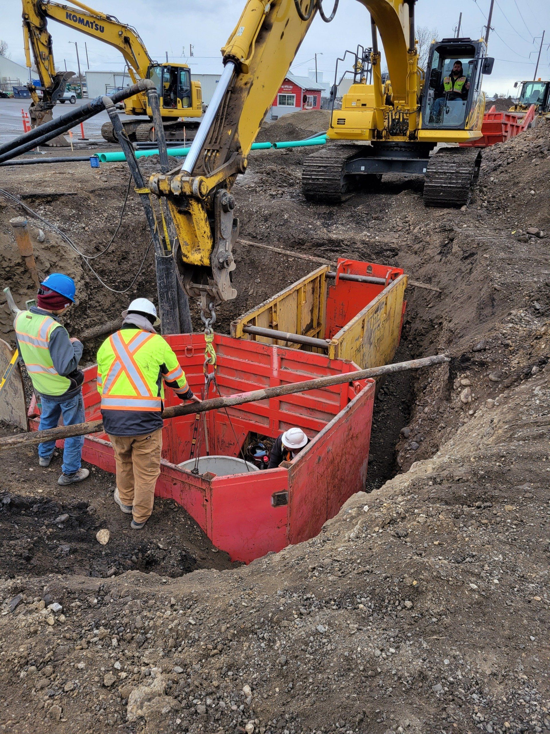 A group of construction workers are working on a construction site.