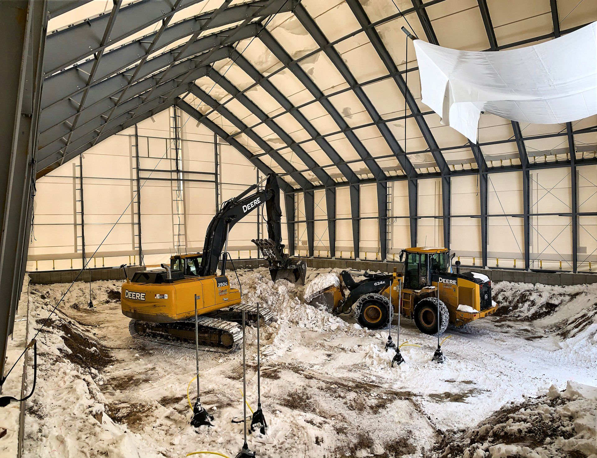 A large building with a lot of snow on the ground.