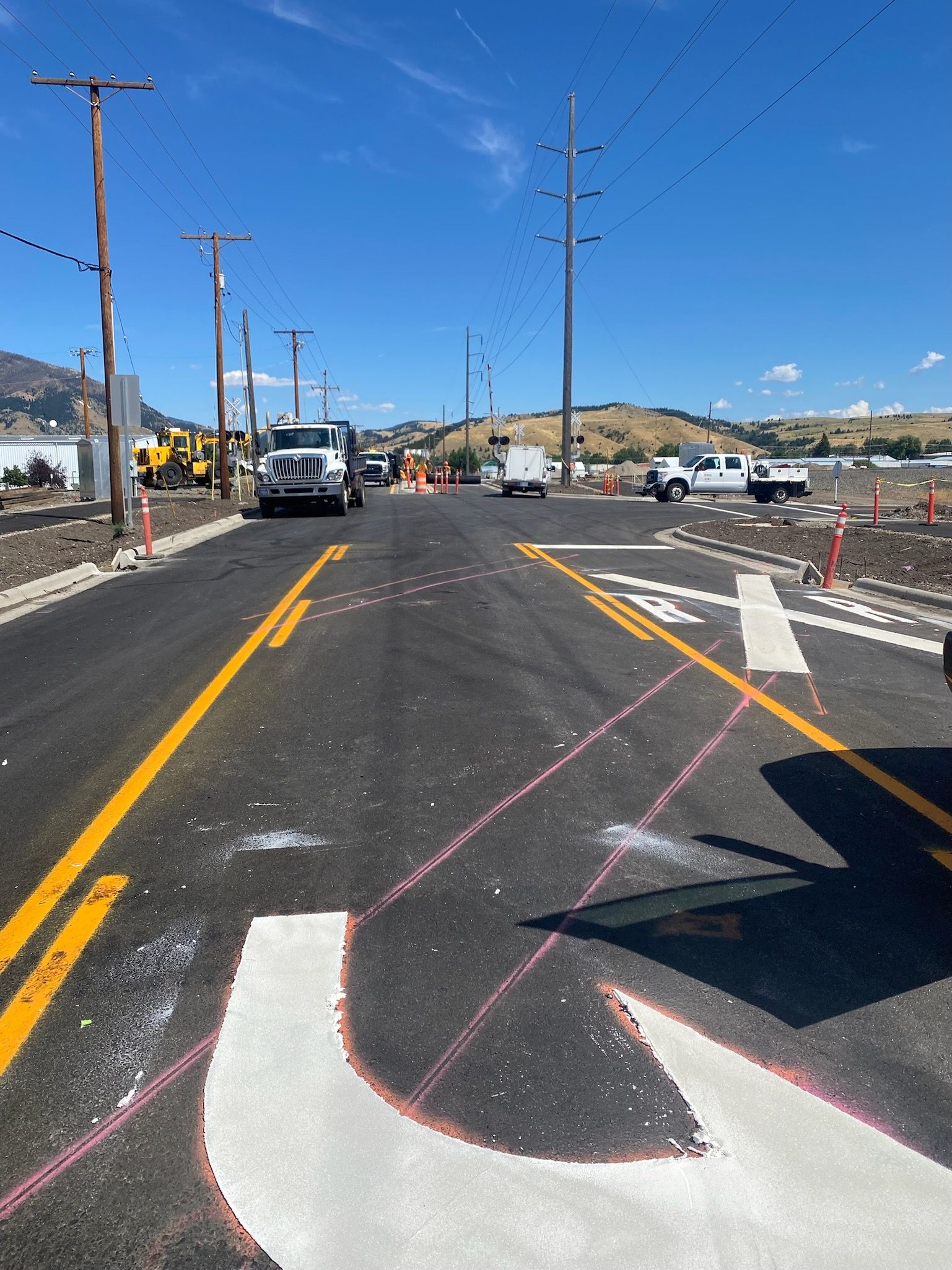 A road with a handicap sign on the side of it