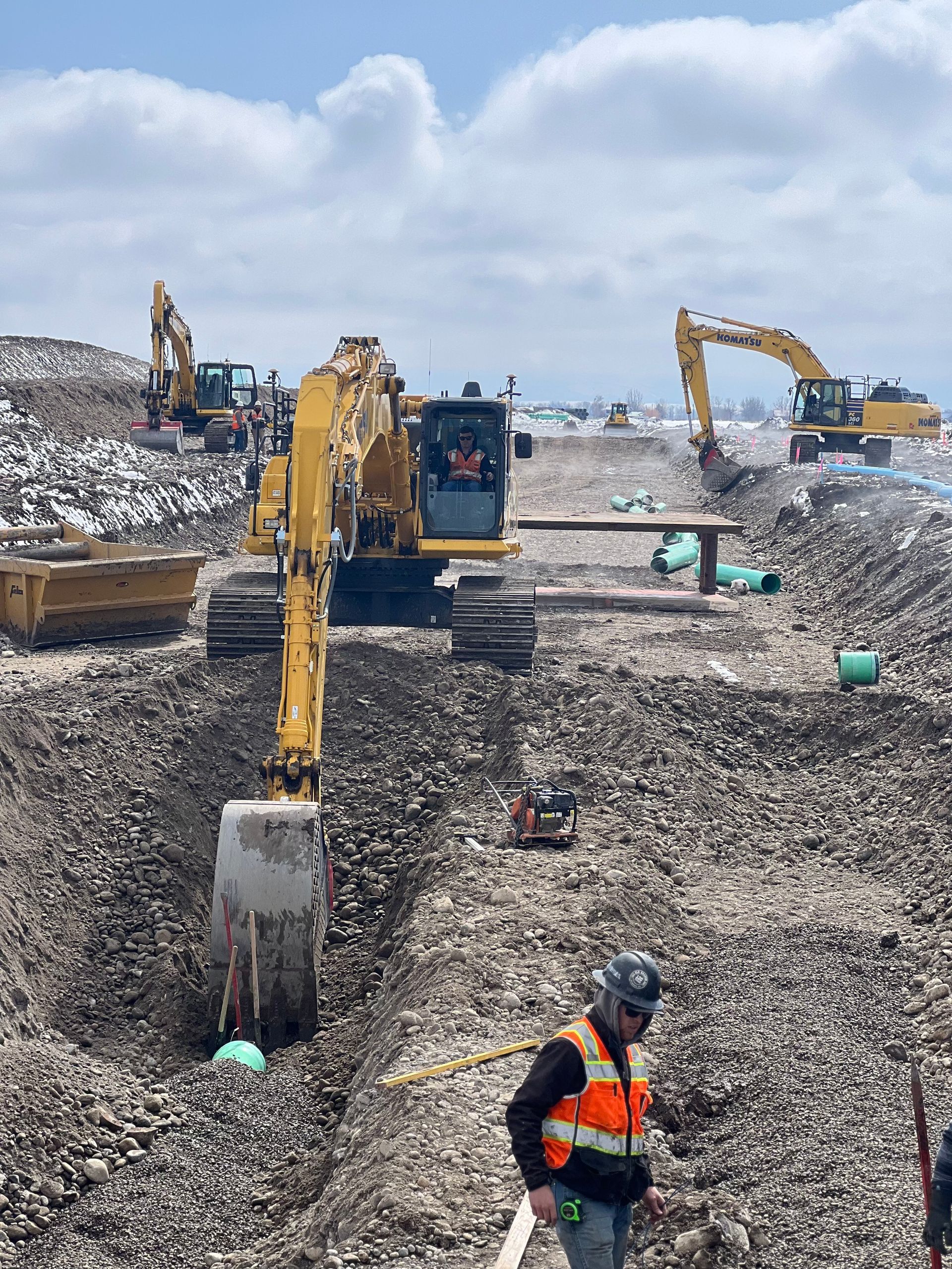 A group of construction workers are working on a construction site.