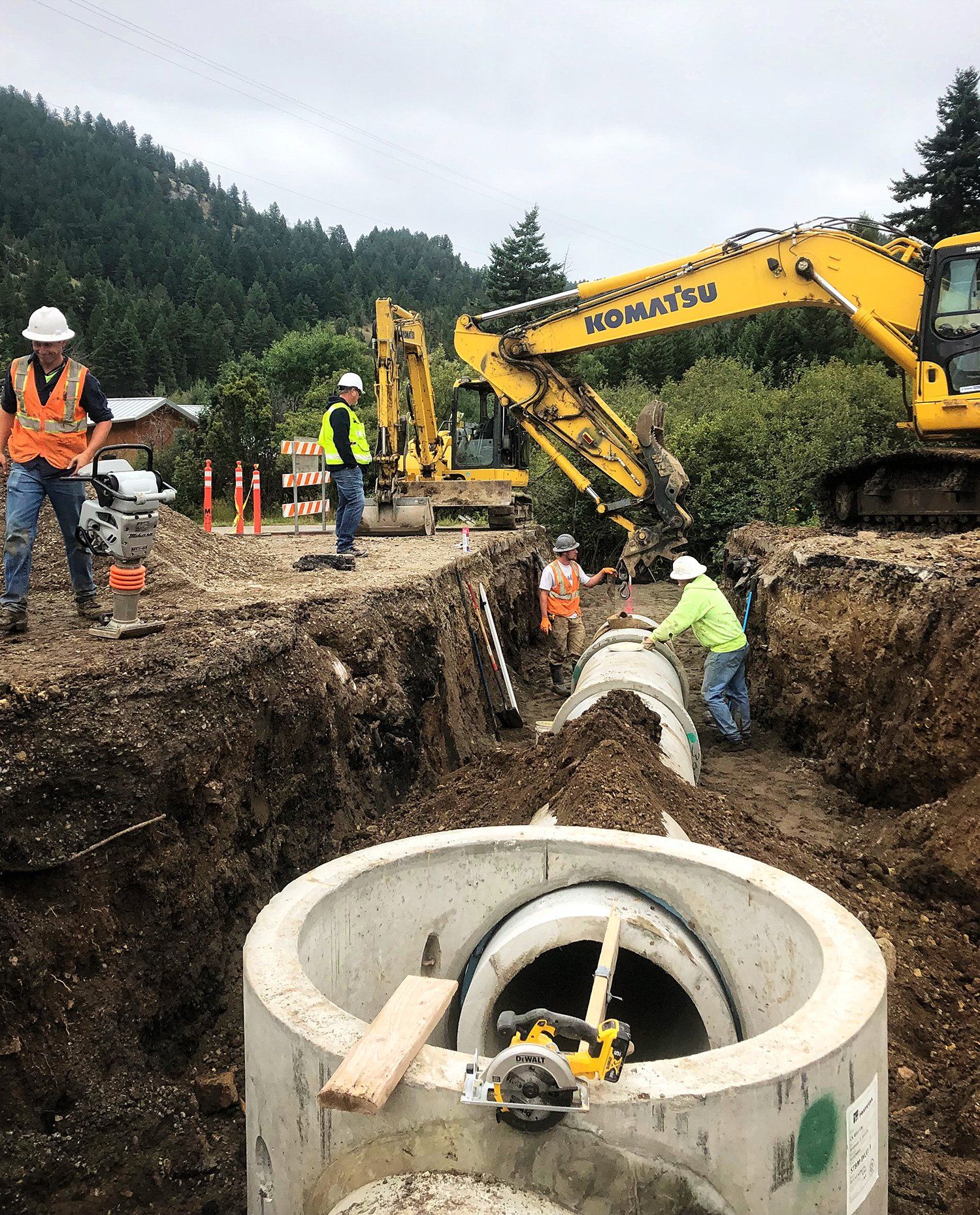 A group of construction workers are working on a construction site.