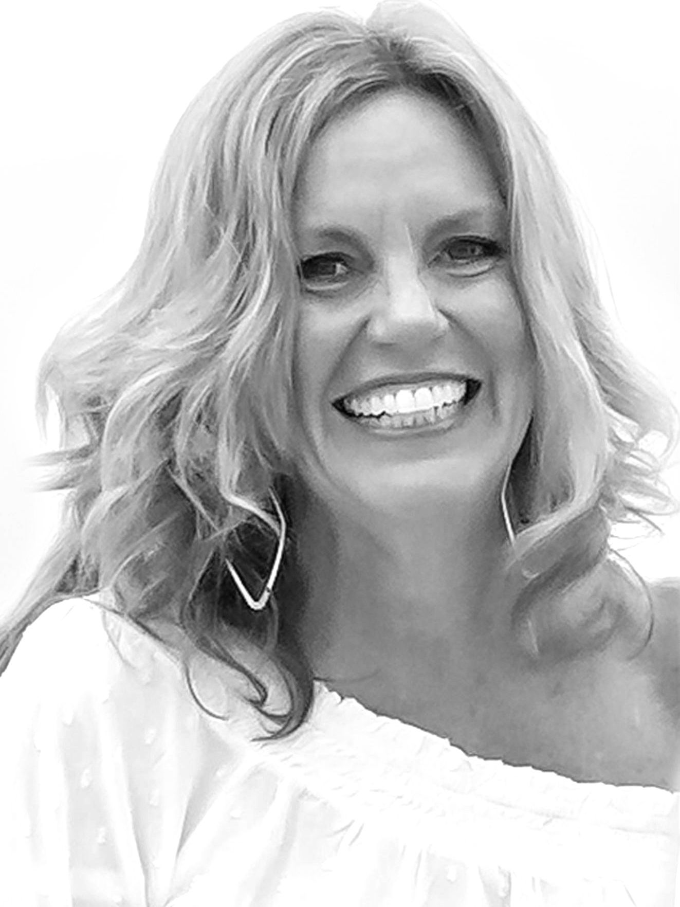 A woman is smiling in a black and white photo.