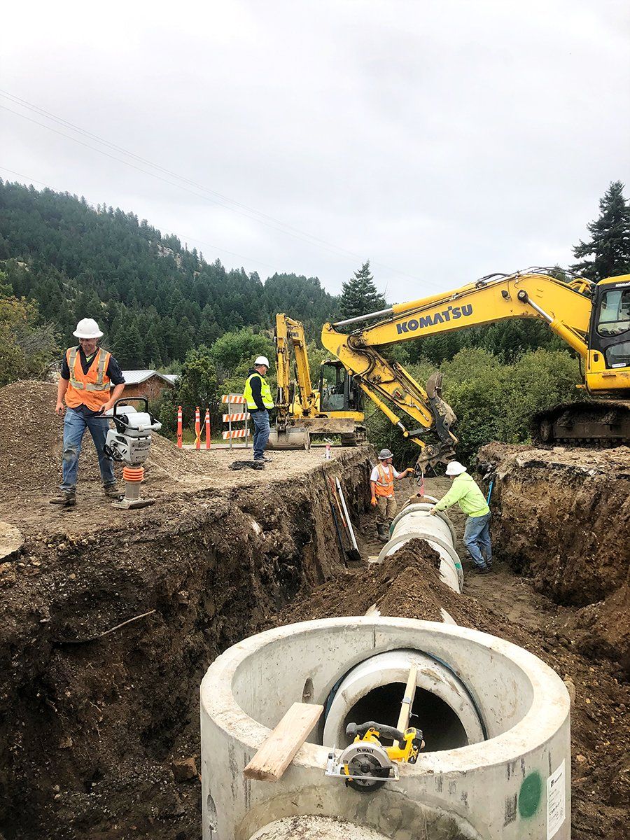 A group of construction workers are working on a construction site.