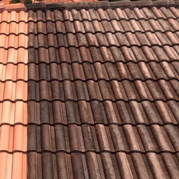 A picture of a roof before and after being cleaned.