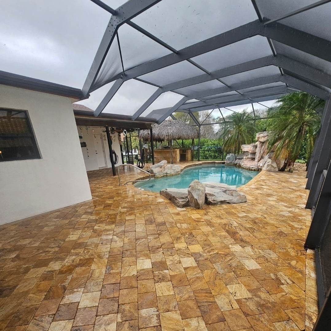 There is a swimming pool in the backyard of a house.