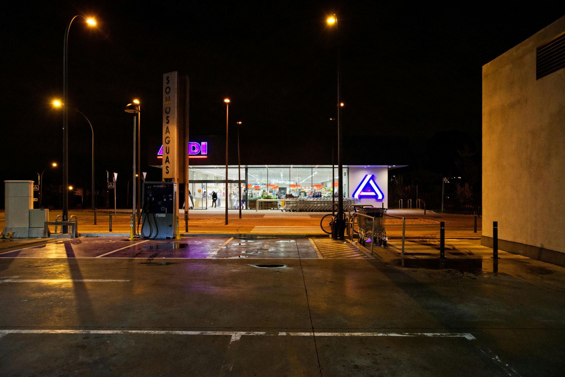 An aldi store is lit up at night