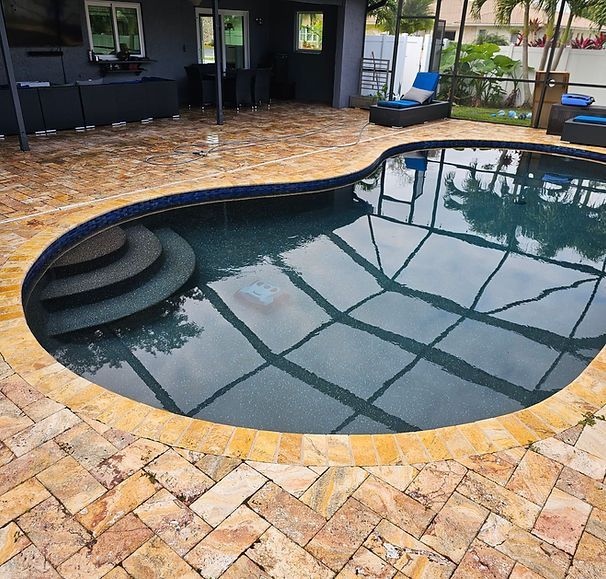 A large swimming pool with stairs leading up to it