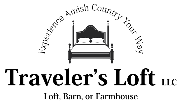 Logo for Traveler's Loft LLC, featuring a bed and text promoting lodging in Amish Country.