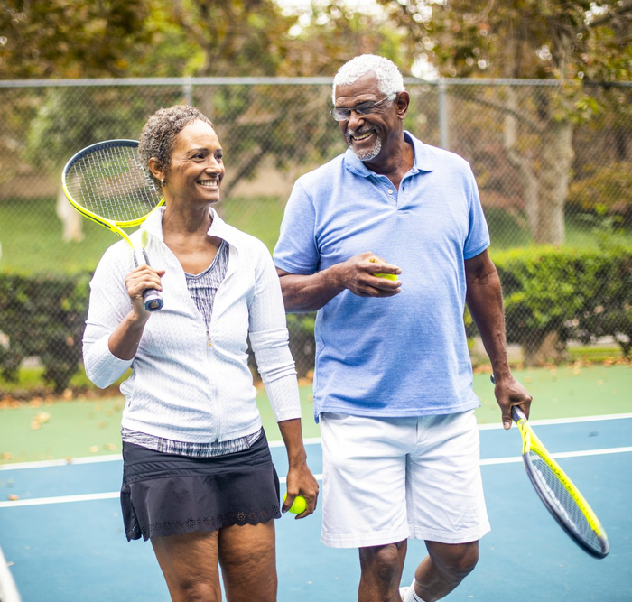 Senior Couple Playing Tennis