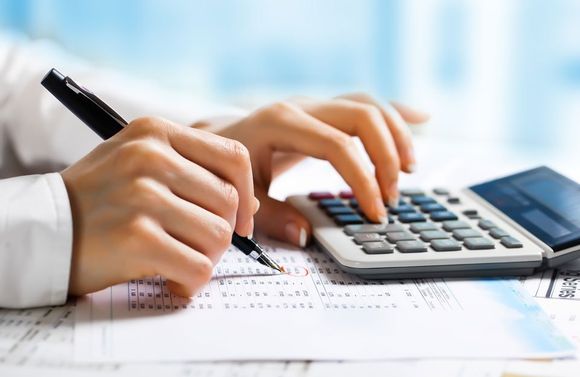 accountant checking the amount in balance sheet
