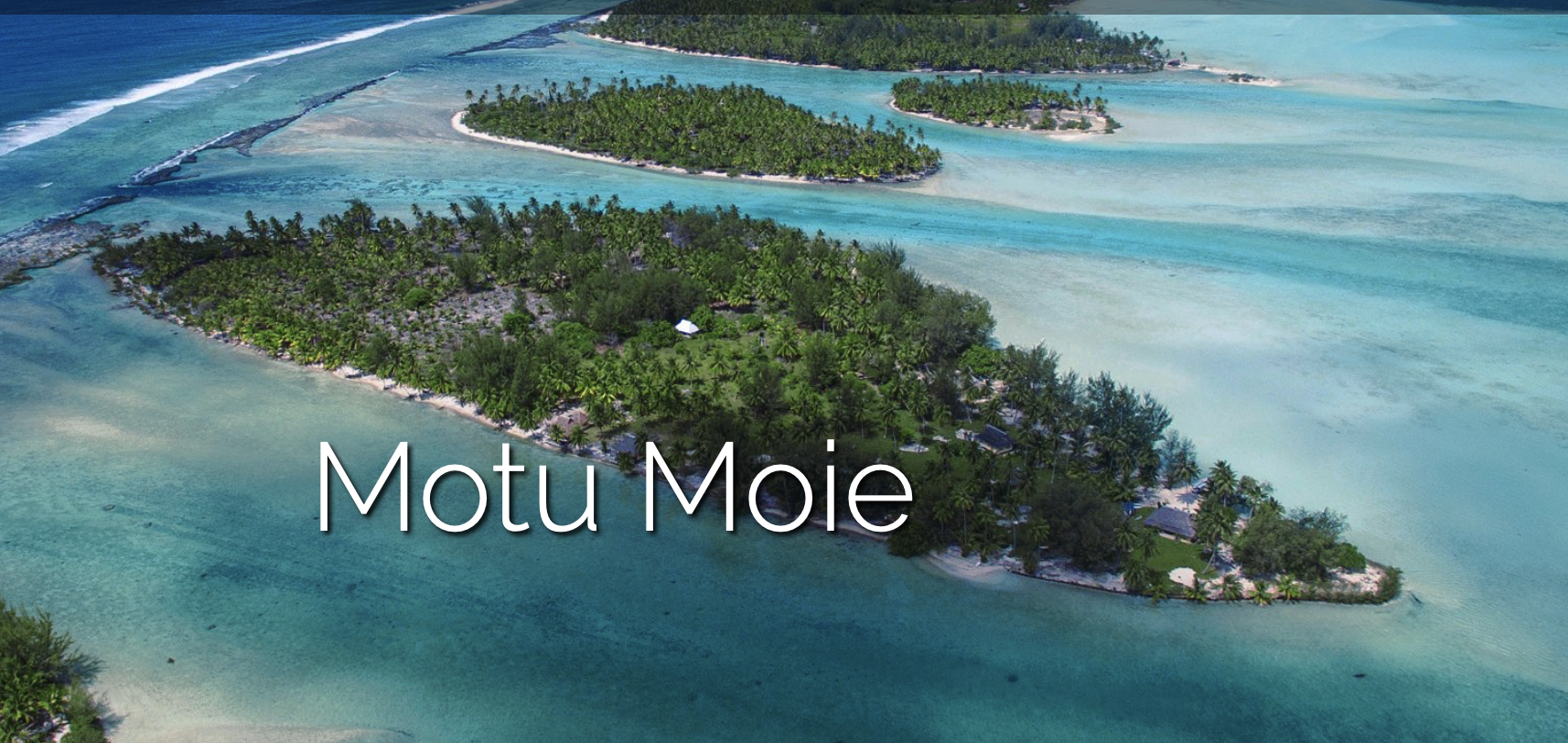 An aerial view of a small island in the middle of the ocean.
