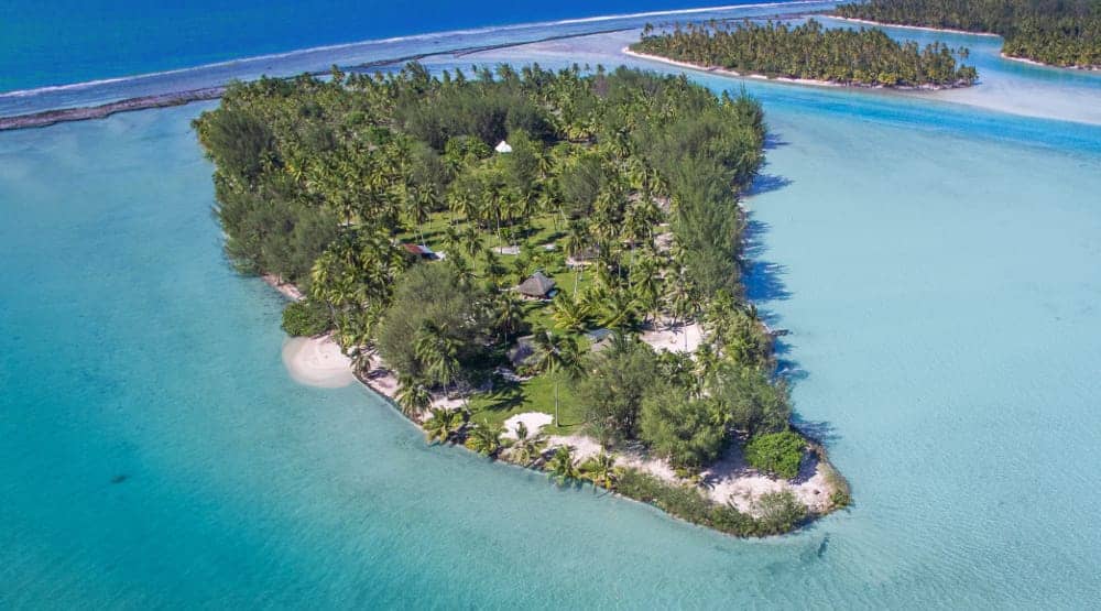 An aerial view of a small island in the middle of the ocean.