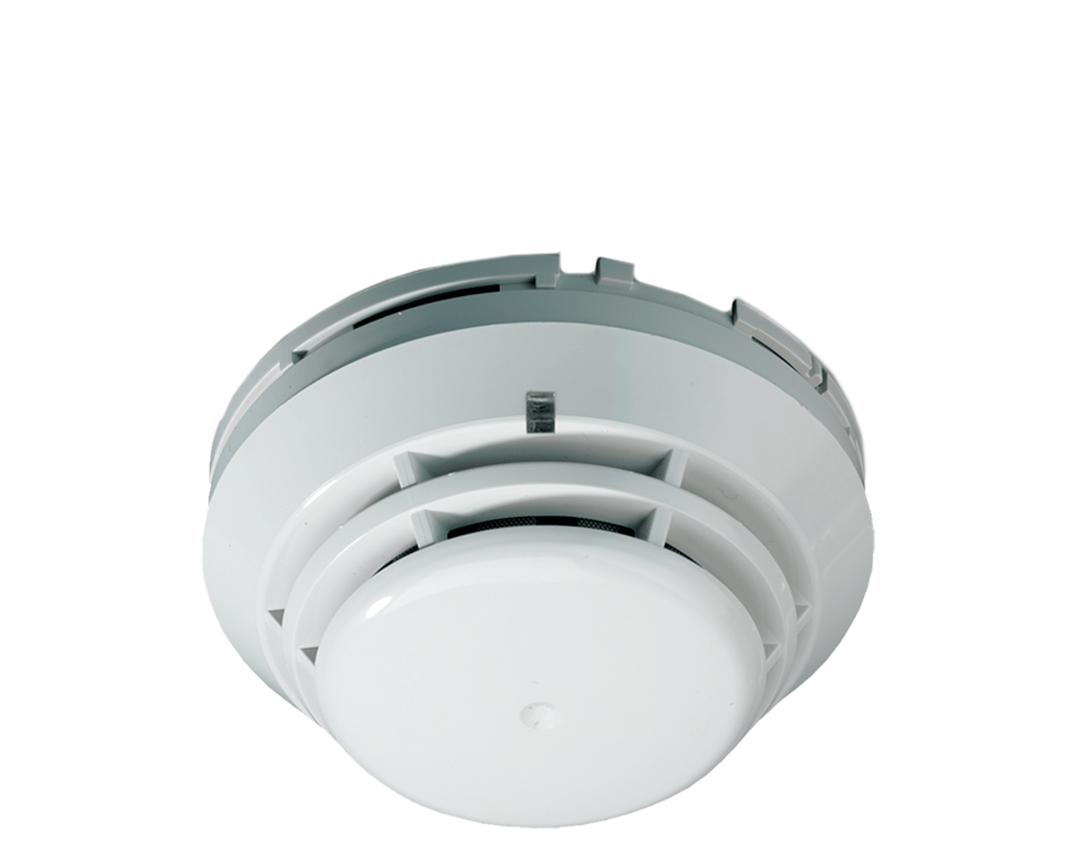 Détecteur de fumée, blanc, circulaire, monté au plafond.
