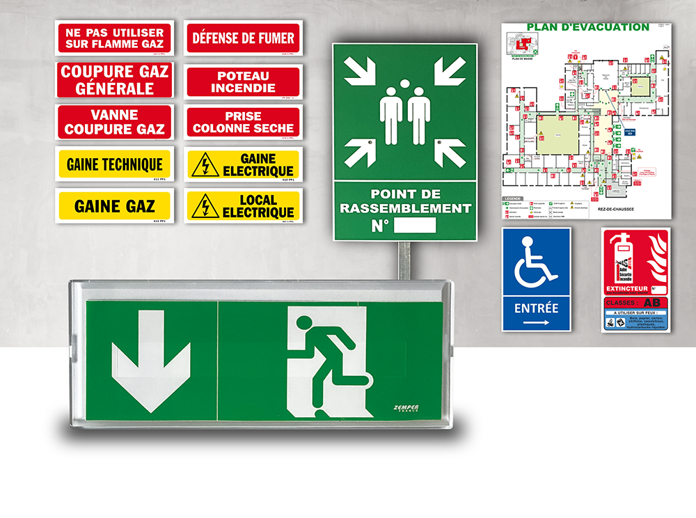 Panneaux d'urgence et de sécurité, y compris un panneau de sortie, un point de rassemblement et un plan de sécurité incendie.