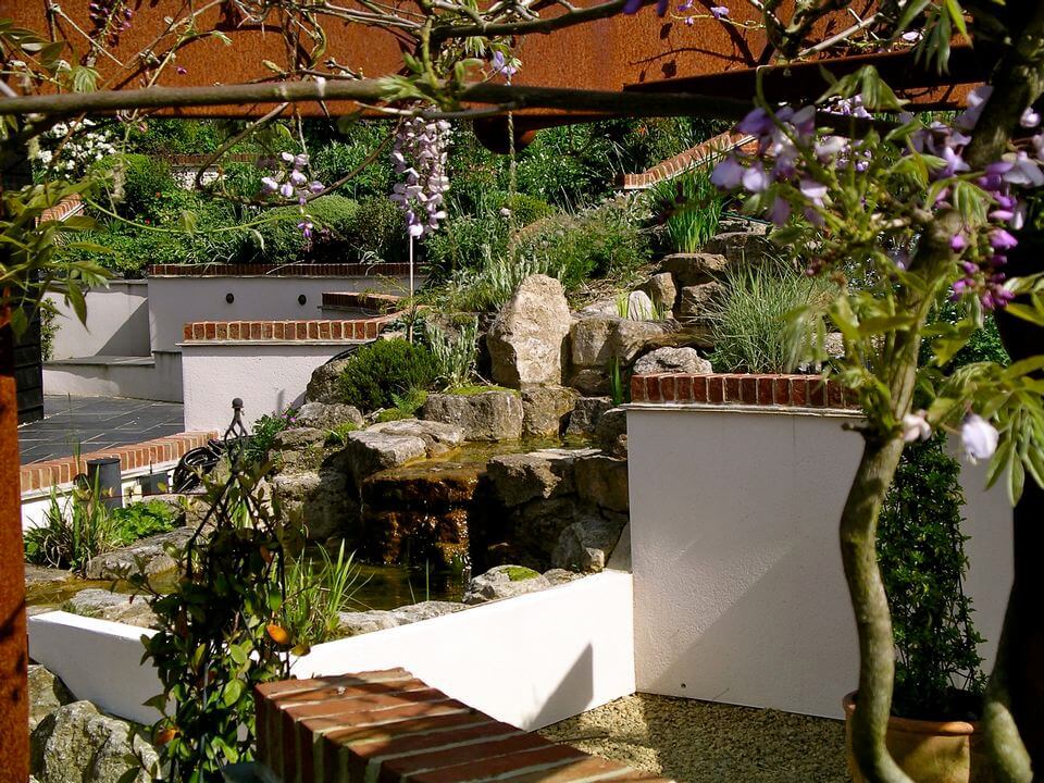 backyard garden with a waterfall on rock formation
