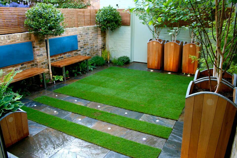 modern small garden with green space and wooden flower pots