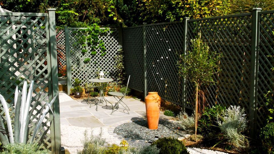 view of a foyer and ceramic pot in a garden