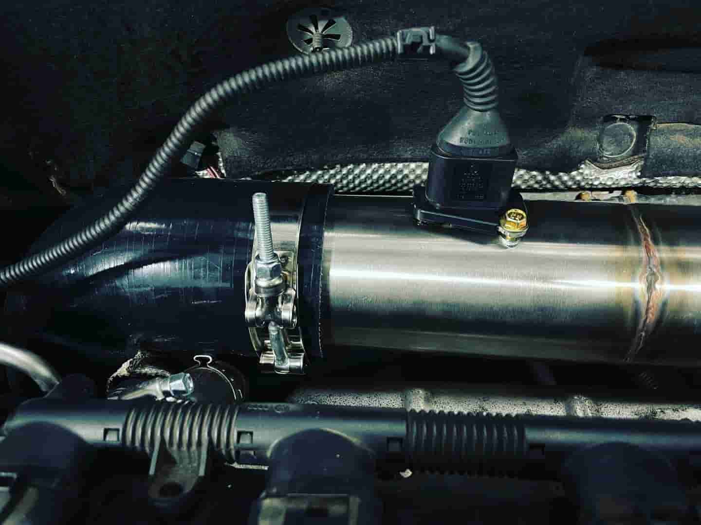 A Close Up Of A Stainless Steel Pipe In A Car Engine — ProStreet Automotive & Fabrication In Cardiff, NSW