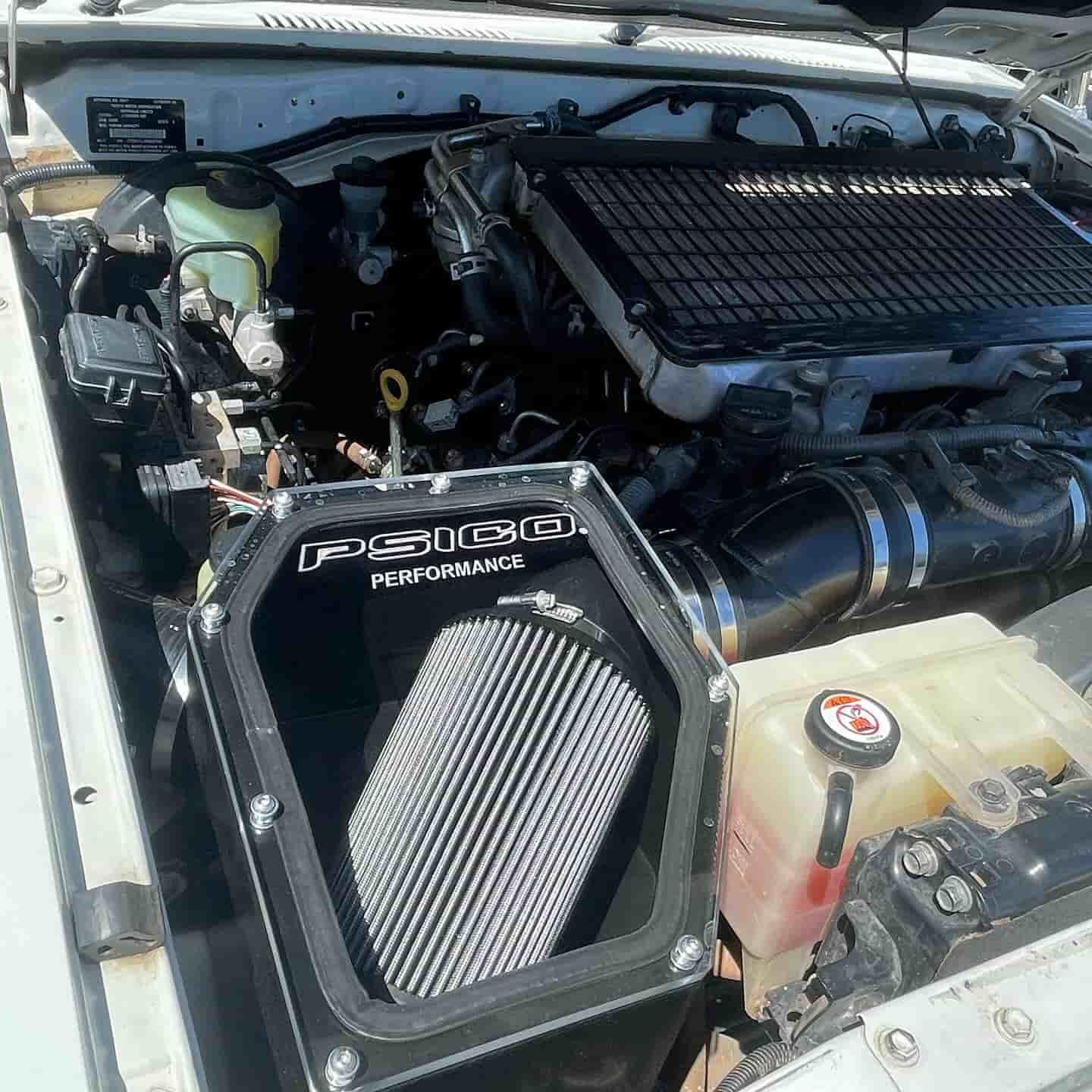 A White Car With A Black Air Filter In The Engine Compartment — ProStreet Automotive & Fabrication In Cardiff, NSW