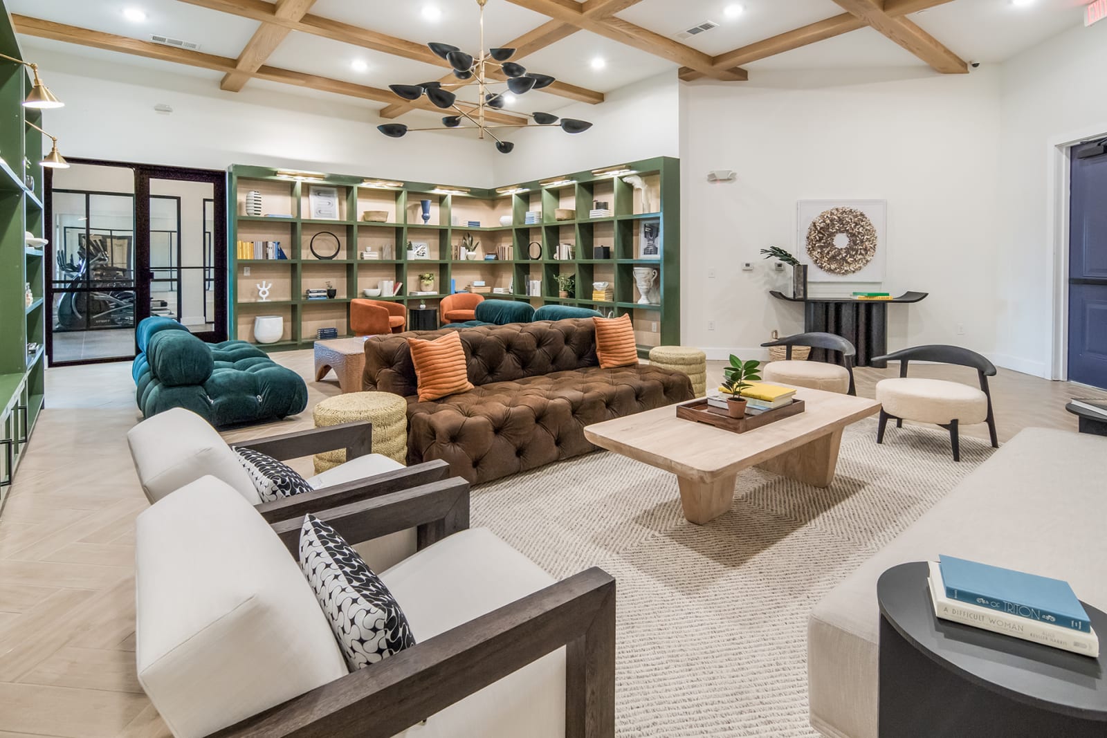 Resident Lounge with High Ceiling and Bookshelf | Cavalli at Iron Horse | North Richland Hills, TX