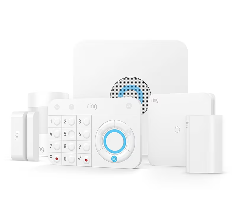 White Ring home security system components, including keypad, base station, and sensors.