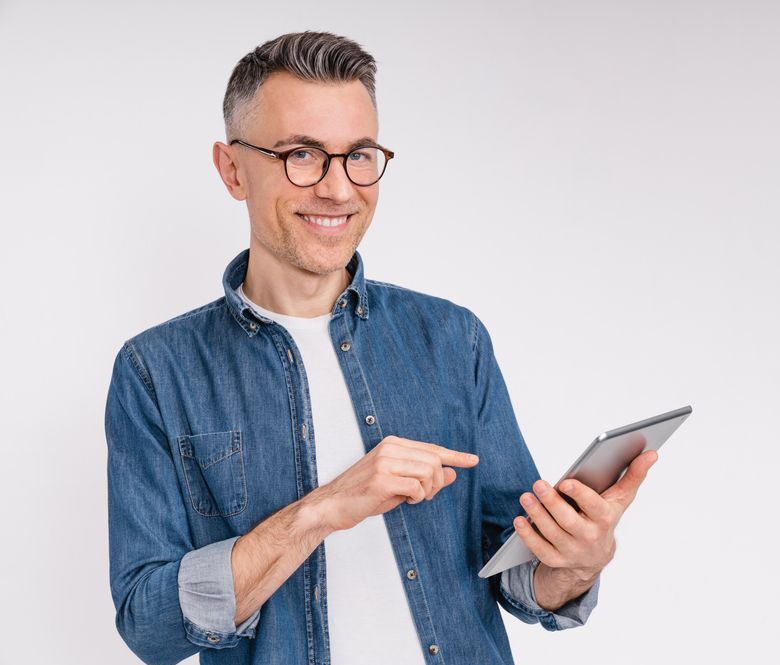 happy man using free internet connection on electronic modern gadget