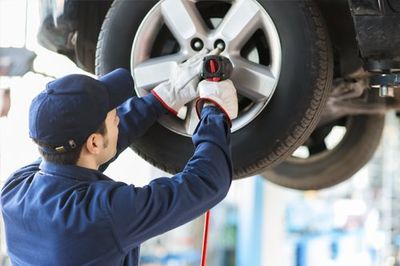 Mechanic Changing a Wheel on Car - Auto Services in Souderton, PA