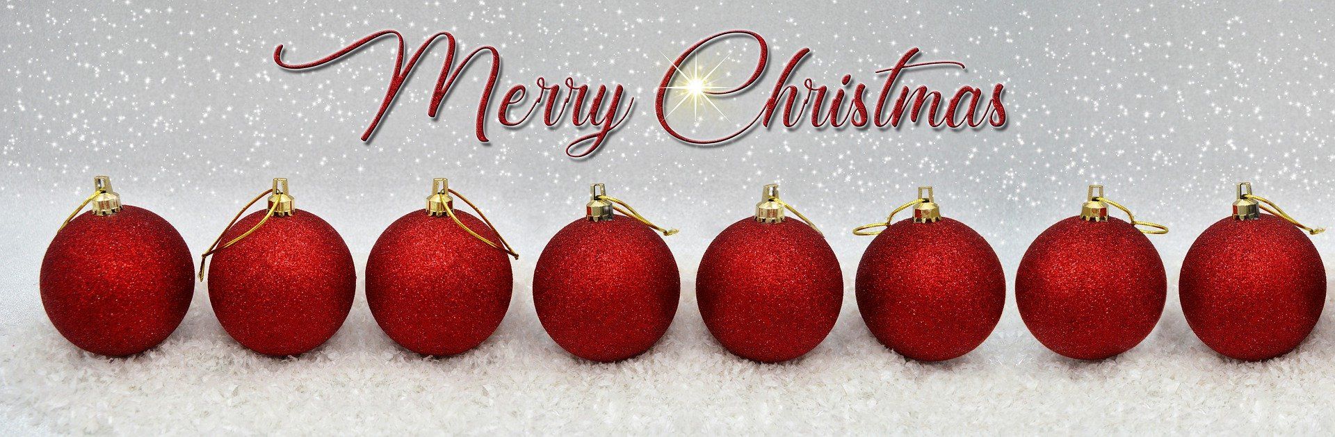 This is a picture of red Christmas balls and the words Merry Christmas