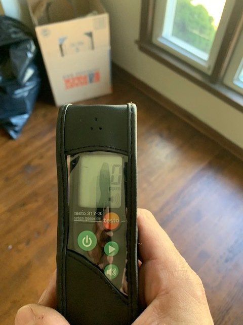 A person is holding a device that says testo on it