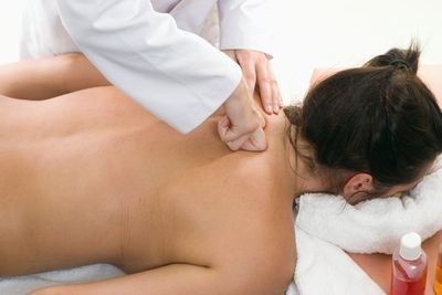 woman getting upper back massage